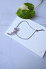 An elegant silver bracelet adjustable with slider.  Wrap around your wrist lavender flowers cascading from crystal chain. 