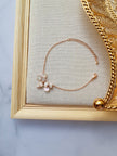 A handmade Rose gold adjustable bracelet with blush pink flowers.