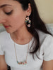 A beautiful handmade flower hoop earrings and a long plastron necklace in gold finish. Hoop earrings and long pendant hand formed and is a bunch of tiny pink Sakura flowers, pastel green leaves, Turquoise beads.