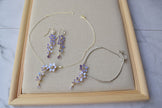 A delicate and elegant choker is handmade with tiny cascading Lavender/purple floral pendant with Zircon teardrop. Matching long earrings dangling with tiny flowers and a zircon. Lavender flower bridal bracelet is adjustable with slider and crystal chain. Excellent jewellery for Wedding, Prom or casual wear. 