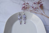A delicate, elegant long silver finish earrings with tiny cascading Lavender/purple flowers with dangling Zircon teardrop, handmade artisan earrings.