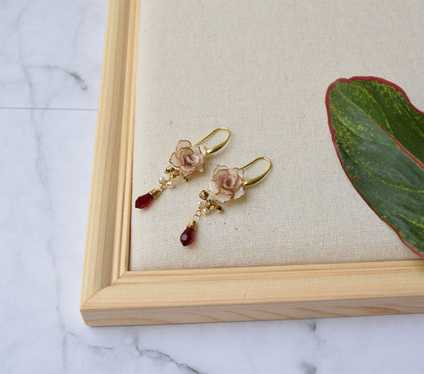 An elegant necklace and long earrings with hand formed Dusty Pink Rose flowers  with gold and red Swarovski crystals with fresh water pearls