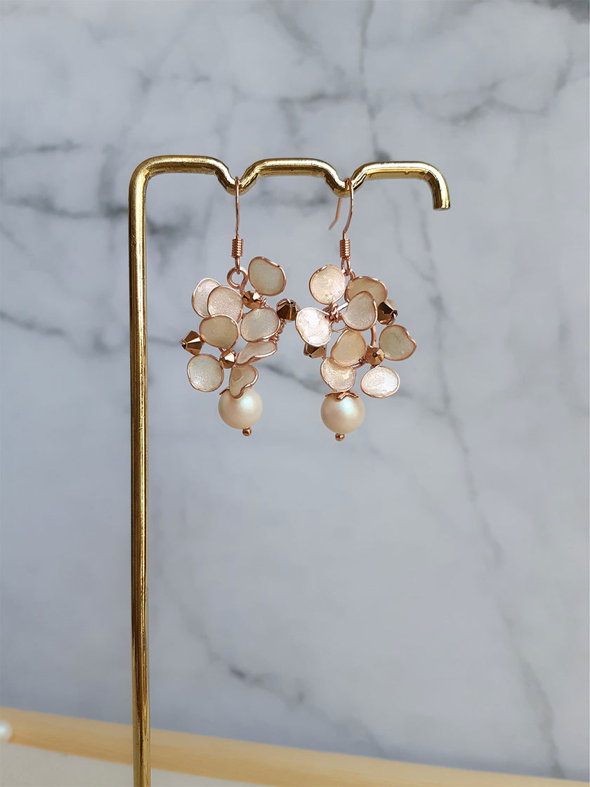Rose gold dangle earrings with hand formed blush flowers, Swarovski pearl and rose gold bicone beads.