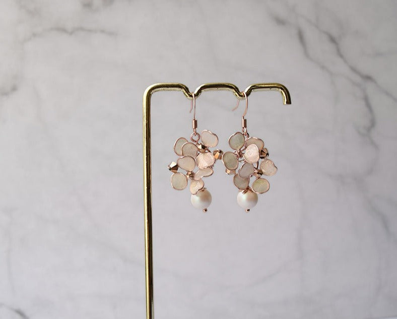 Rose gold dangle earrings with hand formed blush flowers, Swarovski pearl and rose gold bicone beads.