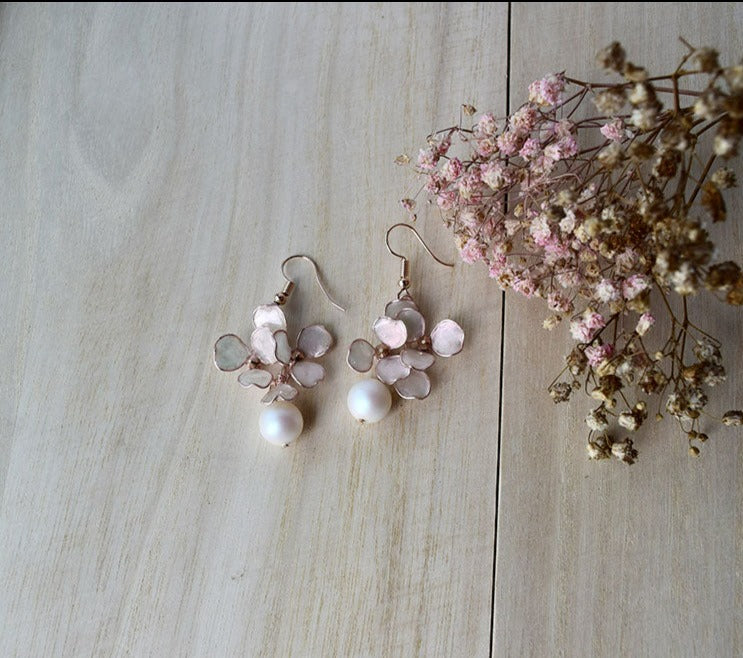 Rose gold dangle earrings with hand formed blush flowers, Swarovski pearl and rose gold bicone beads.