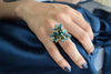 A bright and bold cocktail finger ring adjustable with 3 teal Lily flowers and turquoise beads