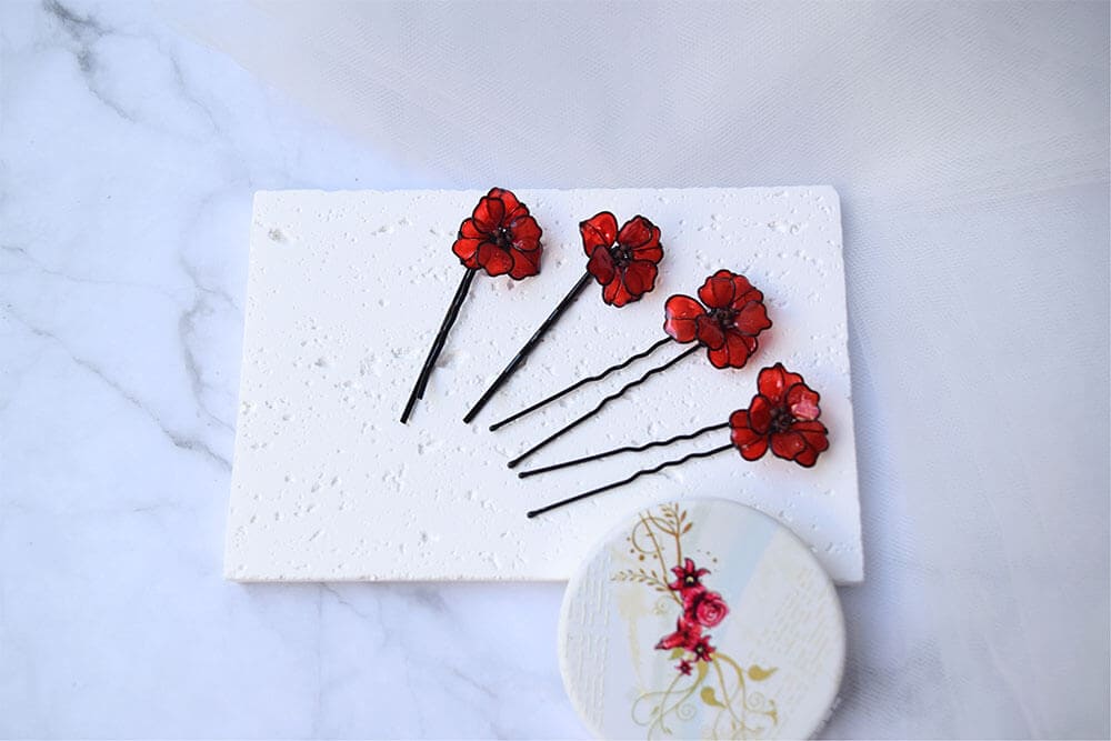 A hand formed Black wire Poppy flowers Hair pins and Hair forks.