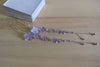 A handmade dangling bridal hair fork, short hair vine with violet/lavender handmade tiny flowers cascading on a chain, pearls and tiny bells.